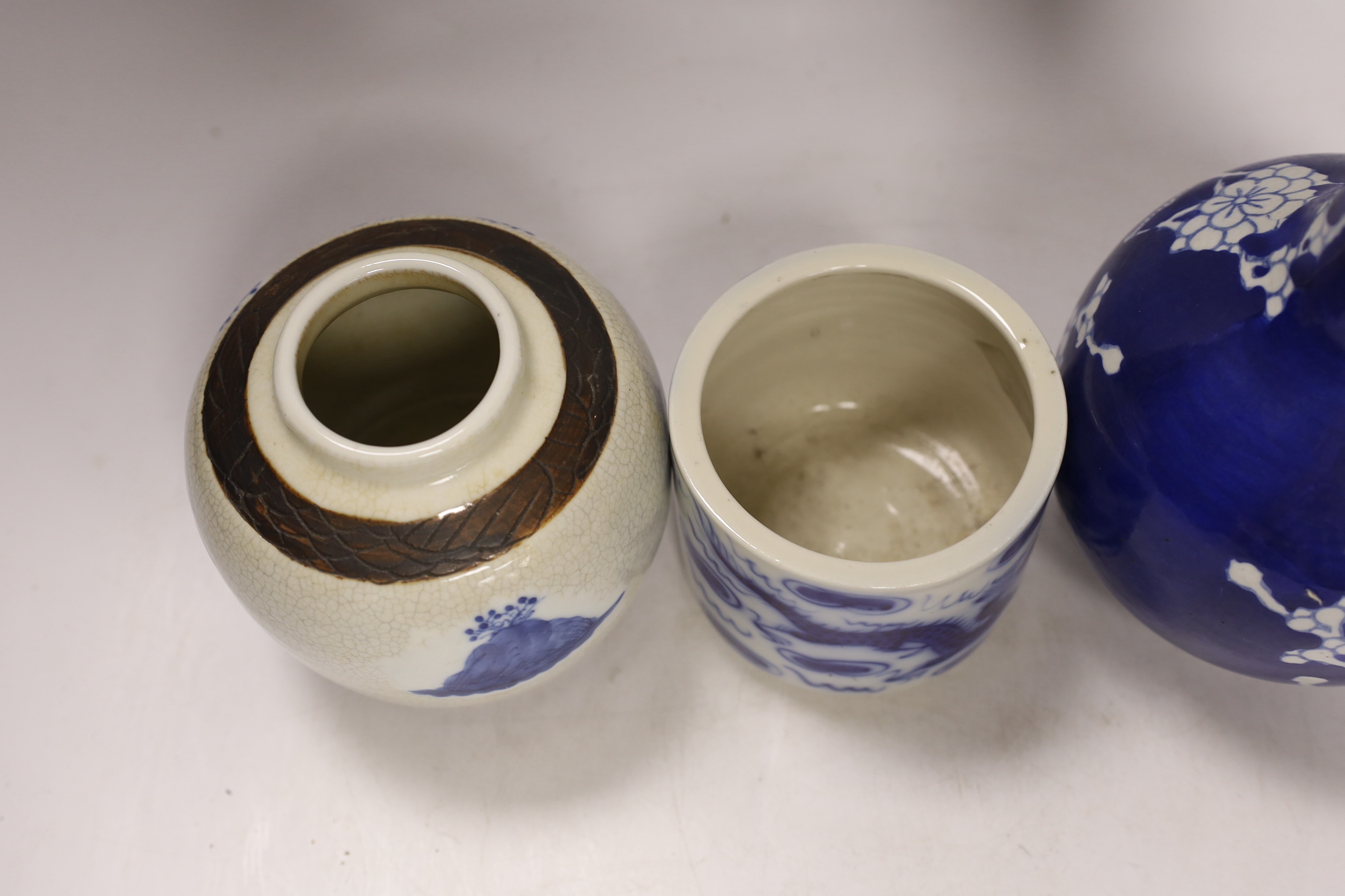 Two Chinese famille rose jars, a similar pot with cover, a brush pot and a vase, 18th century and later, tallest 24cm (5)